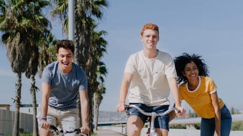 Young adults riding bikes